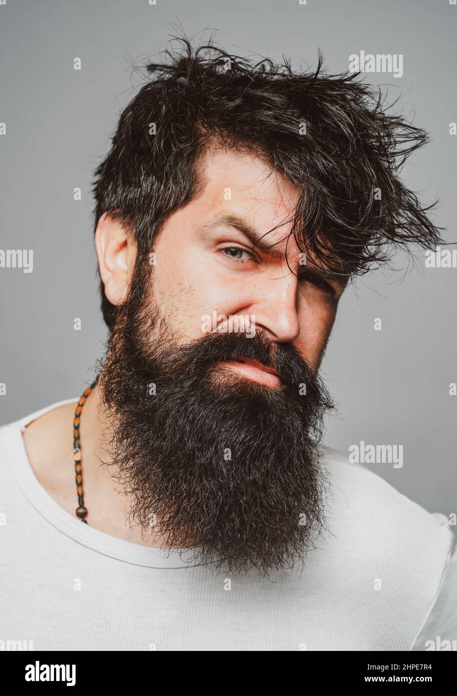 Man haircut, modern hair style. Close up portrait of male model with long  hair. Healthcare and hair care concept. Bearded hipster Stock Photo - Alamy