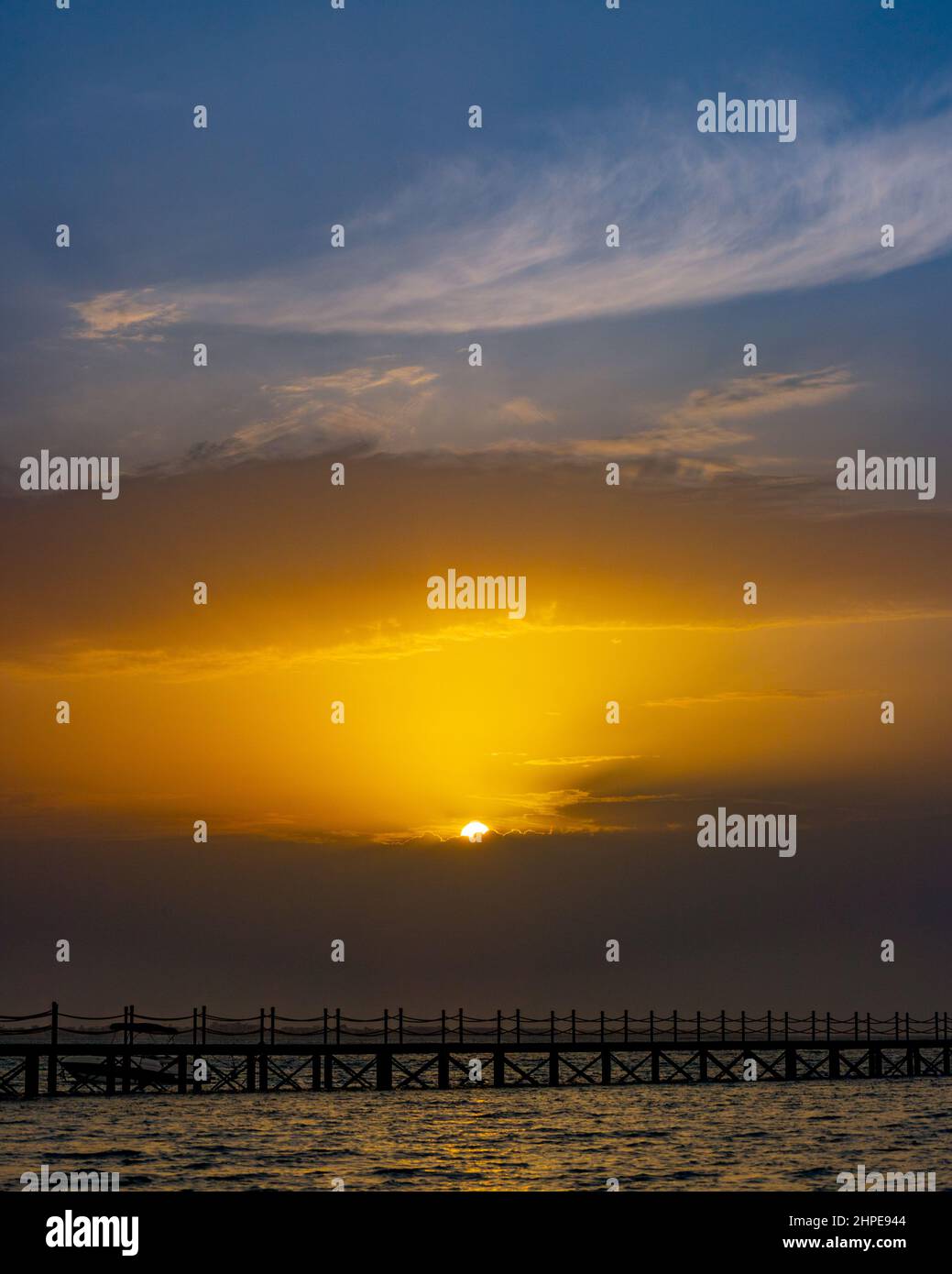 Vertical shot of pier in the sunset Stock Photo - Alamy