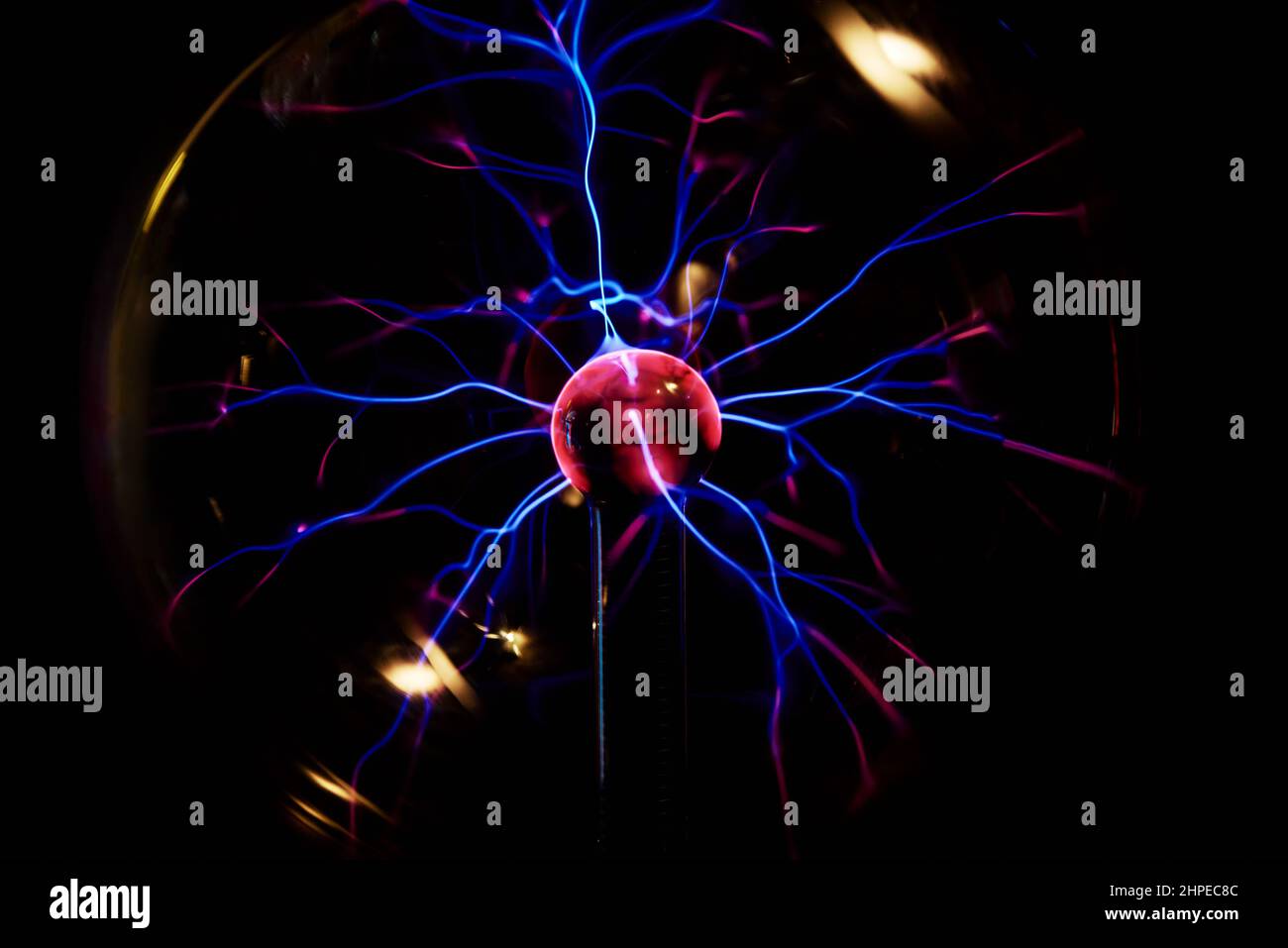 Plasma ball with energy rays on dark background, Physic model of plasma sphere Stock Photo