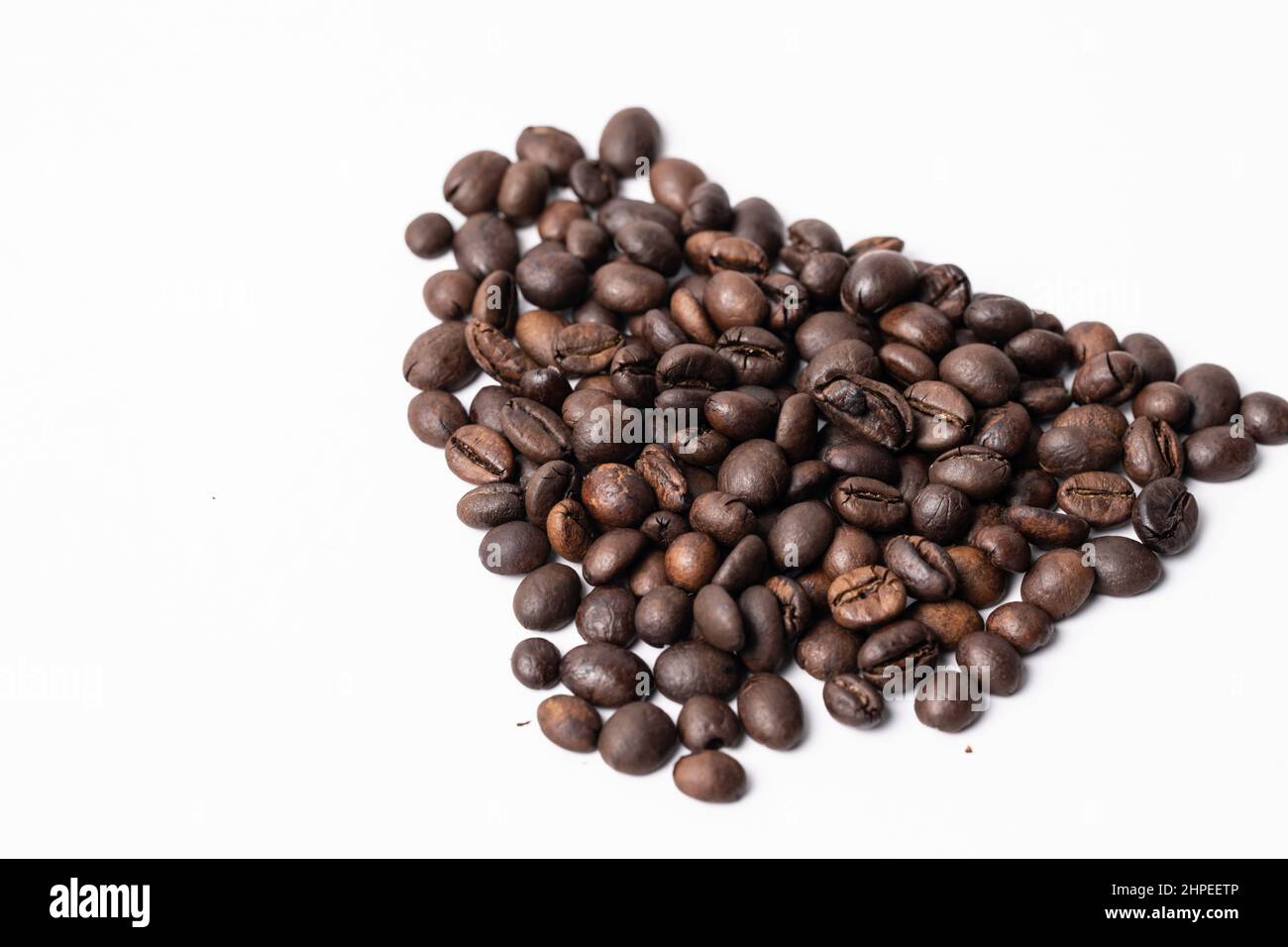 Close-up Roasted coffee beans on white background Stock Photo - Alamy