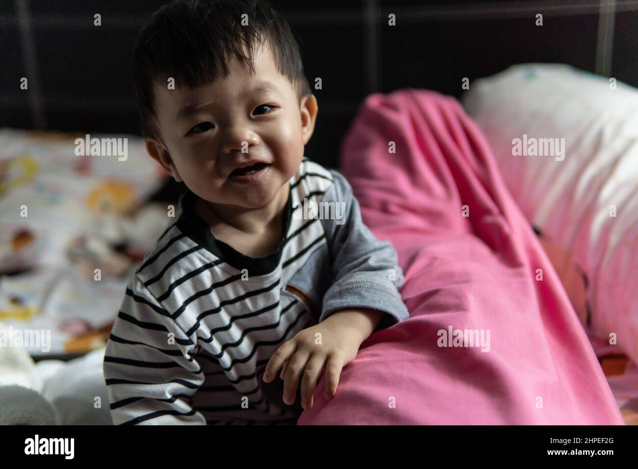 Portrait image of happy expression smile of Asian Chinese baby boy