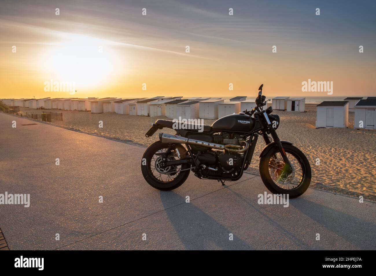 Triumph motorbike at the beach in Calais, France Stock Photo