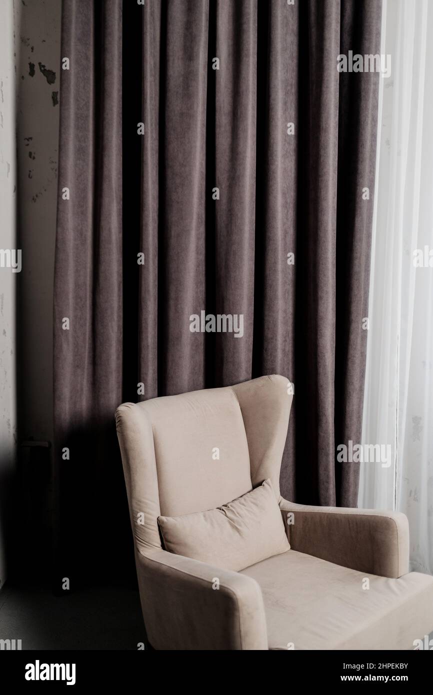 soft chair in gray loft interior. brutal room design Stock Photo