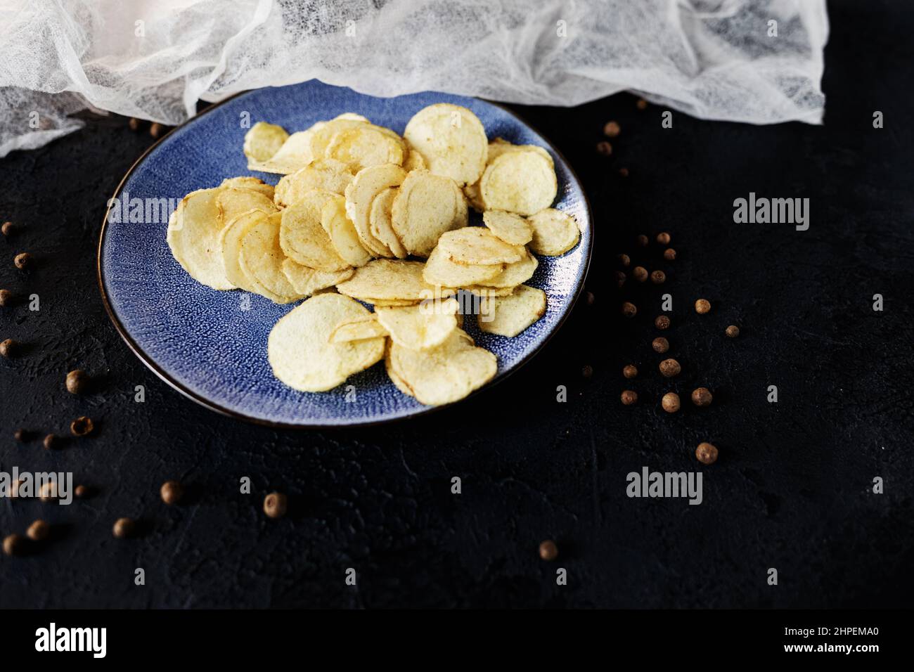 unhealthy potato chips in blue plate. cholesterol Stock Photo Alamy