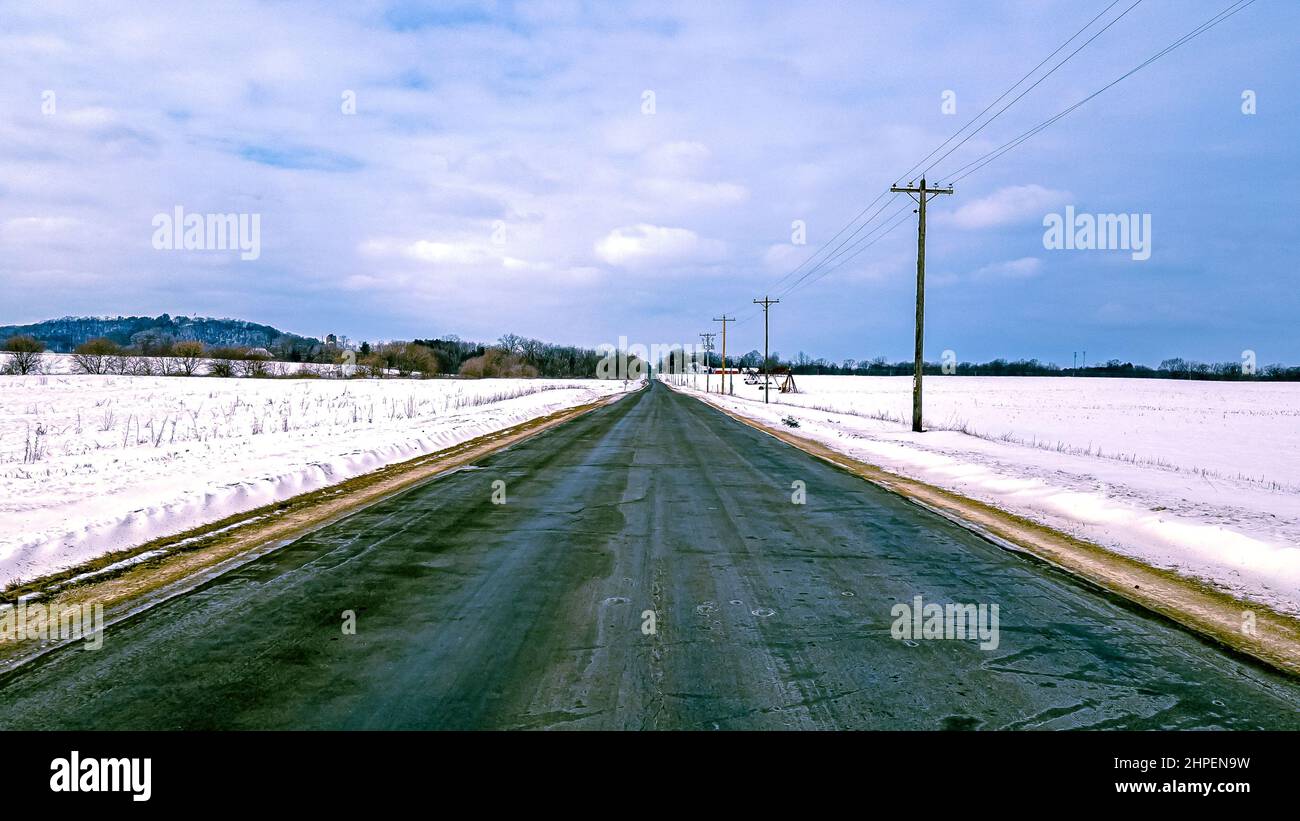 One very bumpy road frozen by the cold in winter. Stock Photo