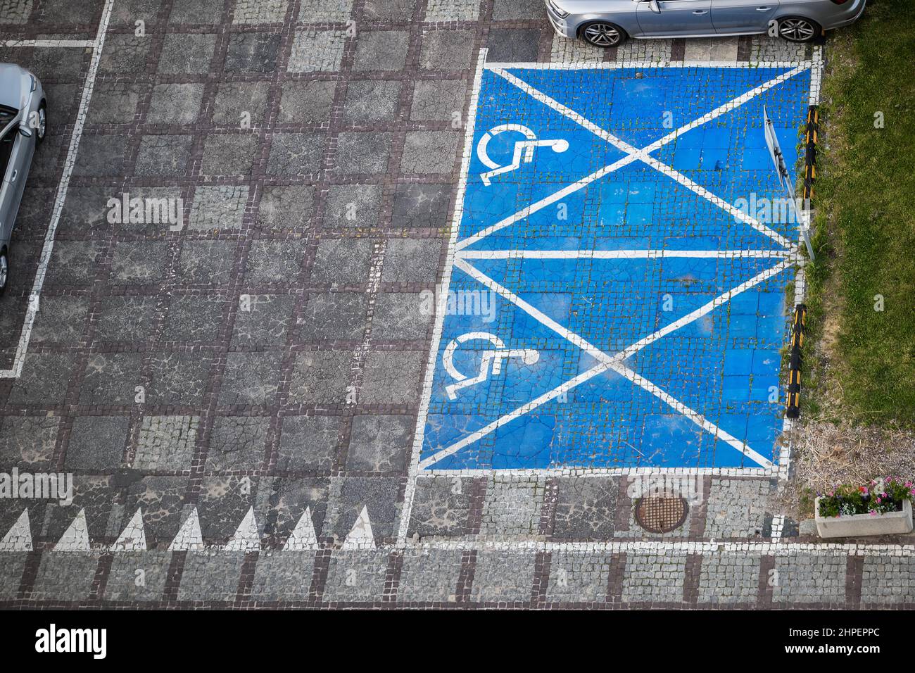 Empty parking lot with car spaces reserved for people with disabilities, aerial view. Stock Photo