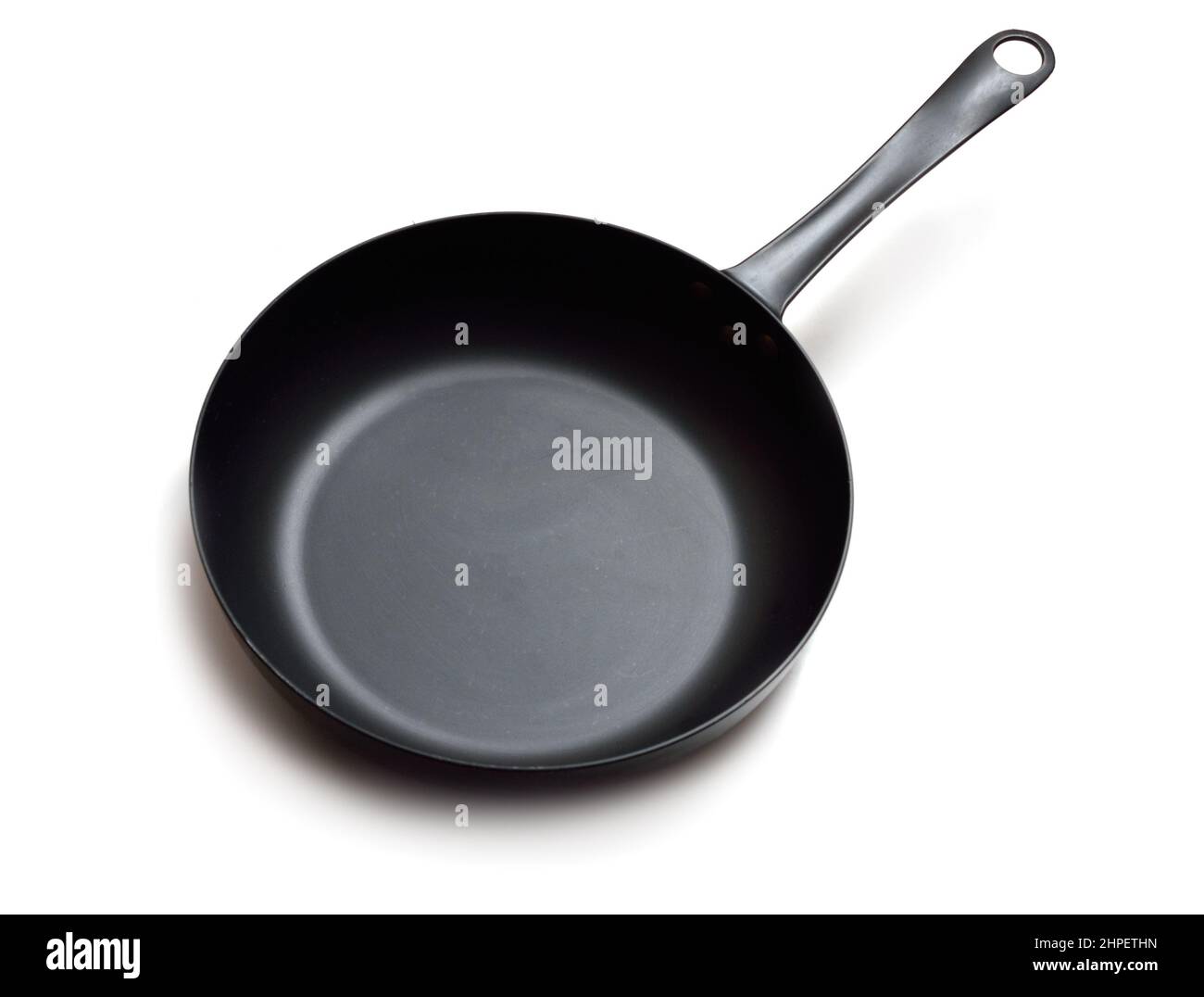 Carbon steels frying pan, frypan, or skillet. Isolated on white