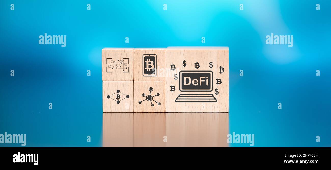 Wooden blocks with symbol of defi concept on blue background Stock ...