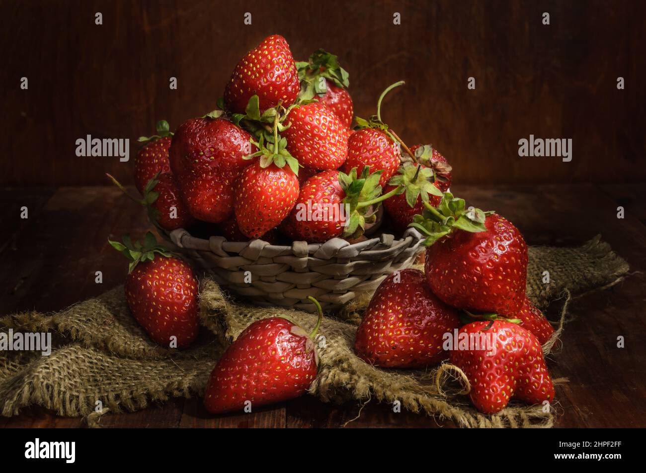 ripe berry on a dark wooden background in a rustic style Stock Photo