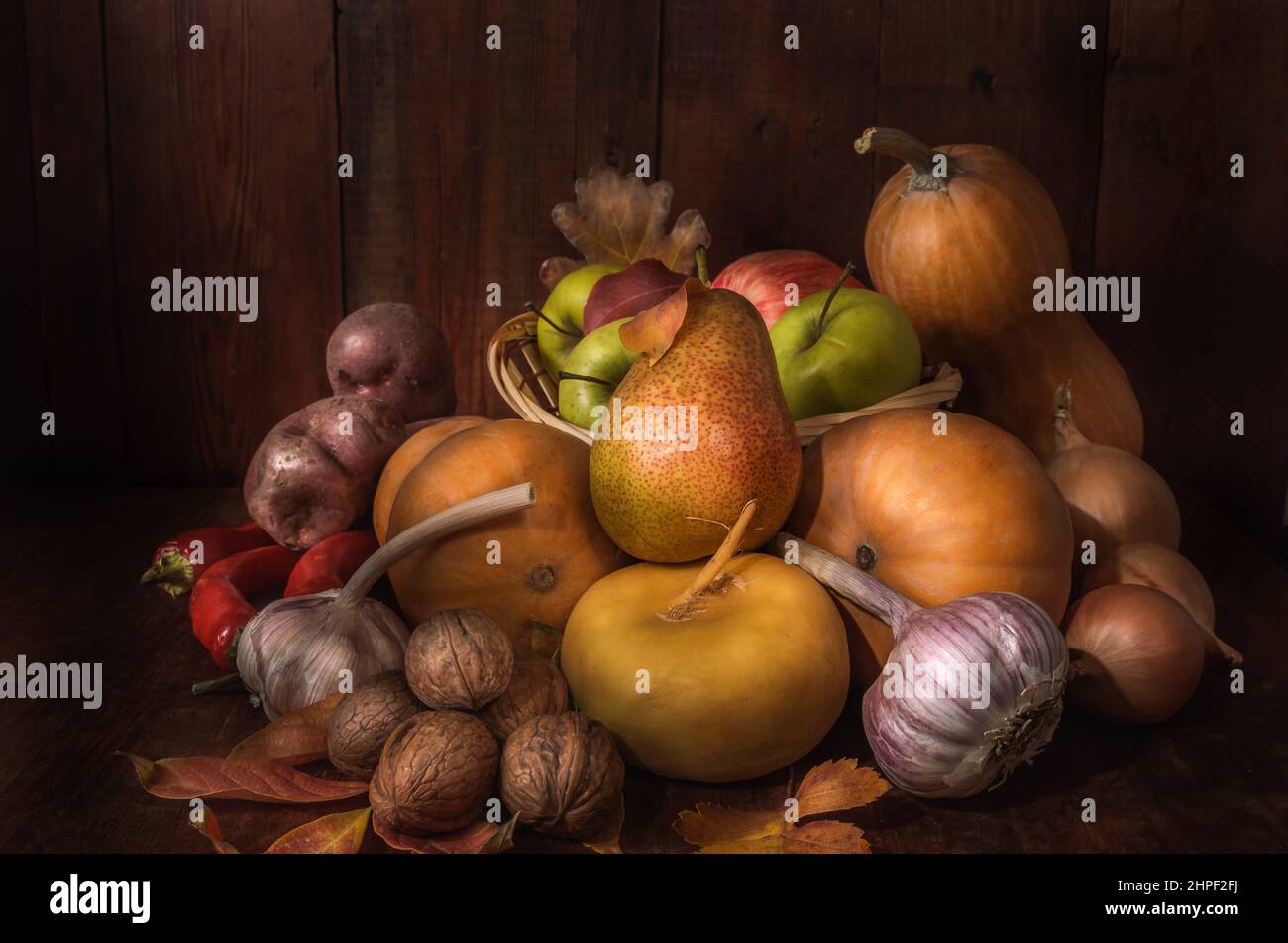 Fruits and vegetables on a dark wooden background in a rustic style Stock Photo