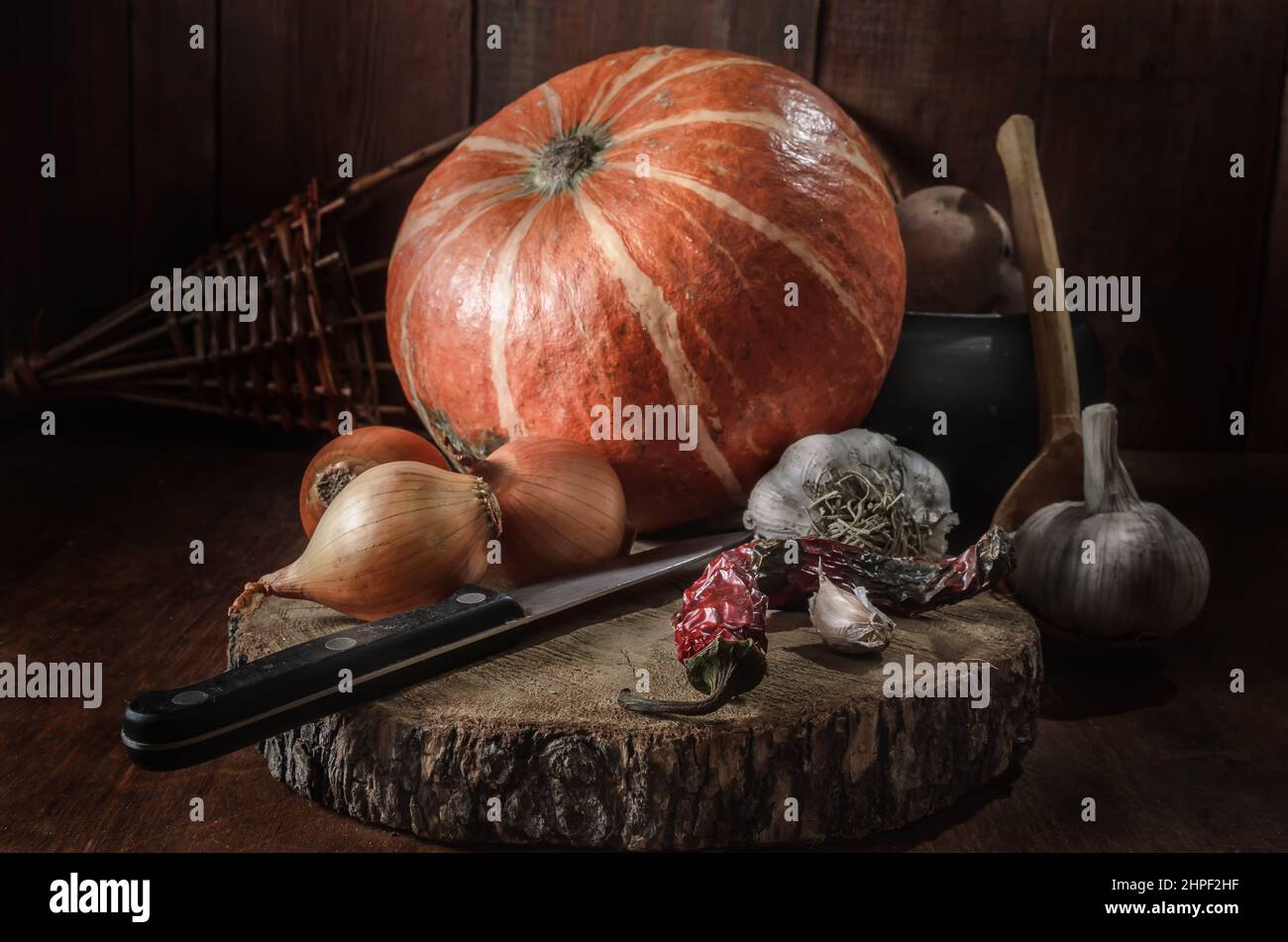Pumpkin and other vegetables on a dark wooden background Stock Photo