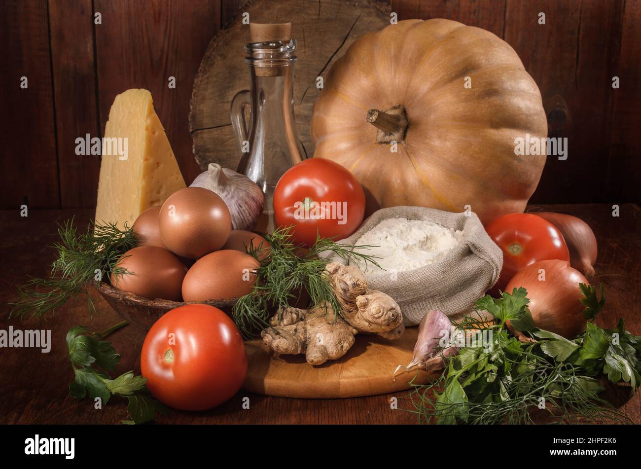 pumpkin and other ingredients for pumpkin casserole on a dark background Stock Photo