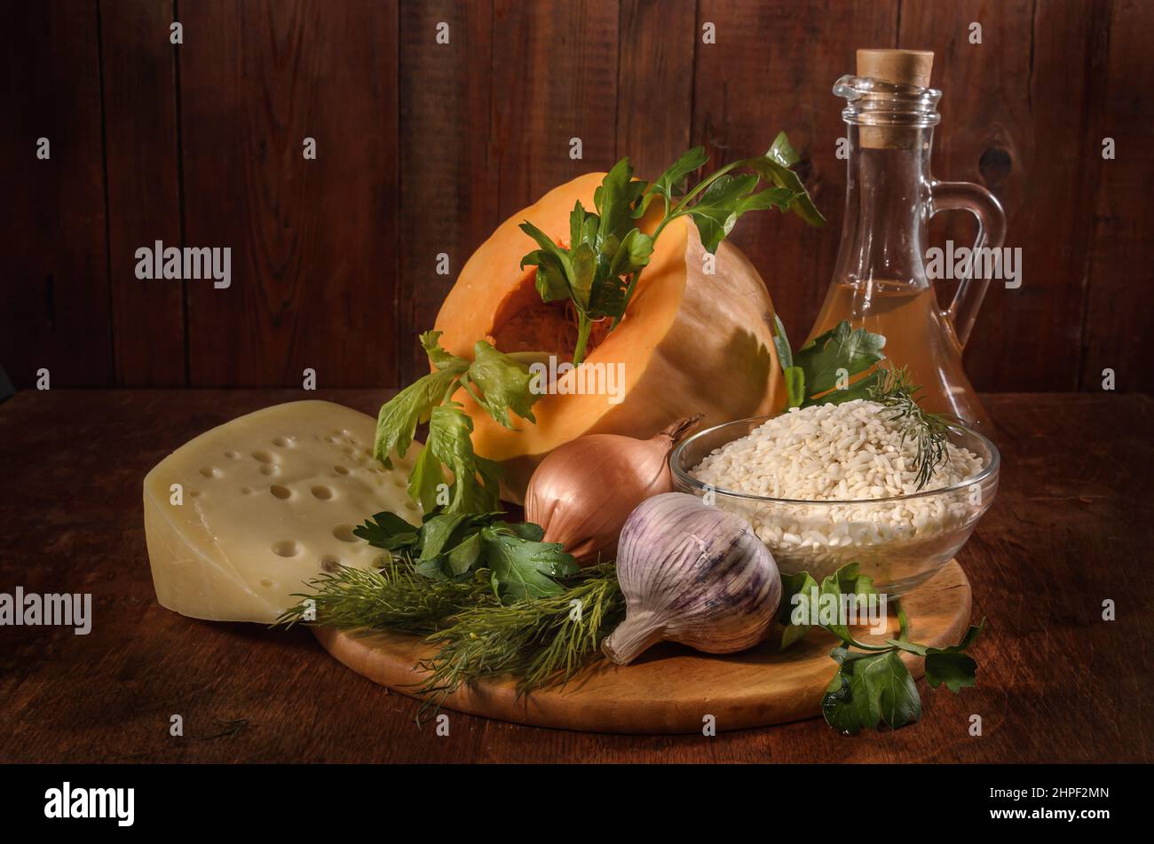 pumpkin and ingredients for pumpkin casserole with rice on a dark background Stock Photo