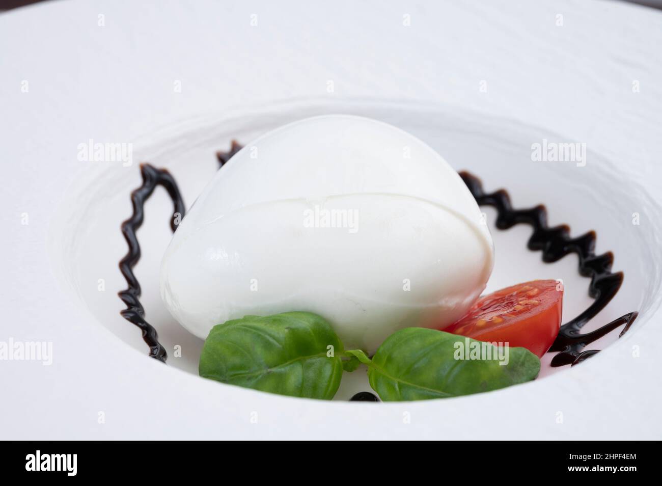 Tasing of fresh italian cheese mozzarella di buffalo with Balsamic ...