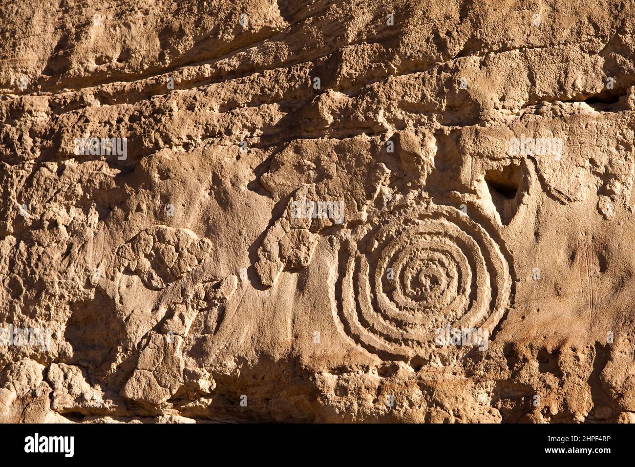 An ancient Ancestral Puebloan petroglyph rock art panel in the Chaco Culture National Historical Park in New Mexico. Stock Photo