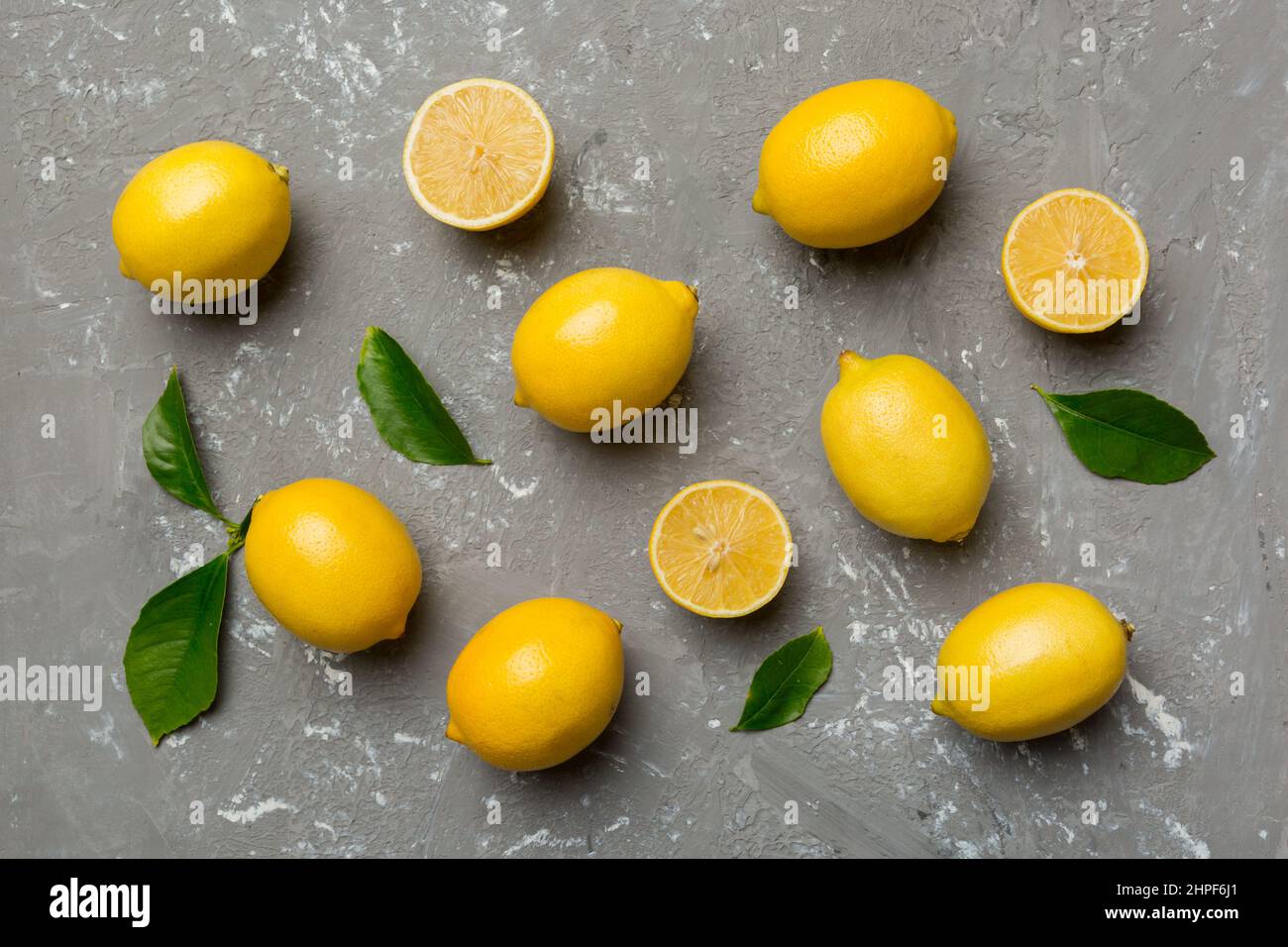 Many fresh ripe lemons as colored background, top view. Elegant ...