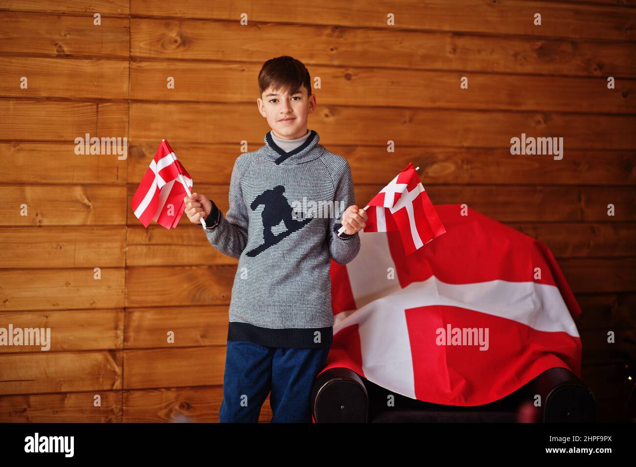 Boy with Denmark flags. Travel to Scandinavian countries. Happiest danish people's . Stock Photo