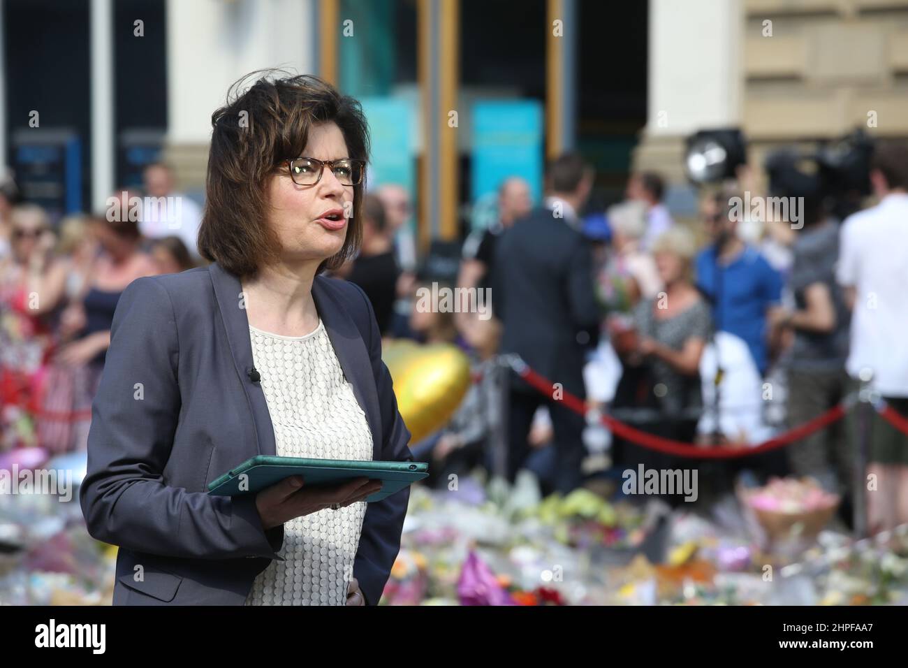 Jane Hill in St Ann's Square while covering the aftermath of the Manchester bombing for the BBC Stock Photo