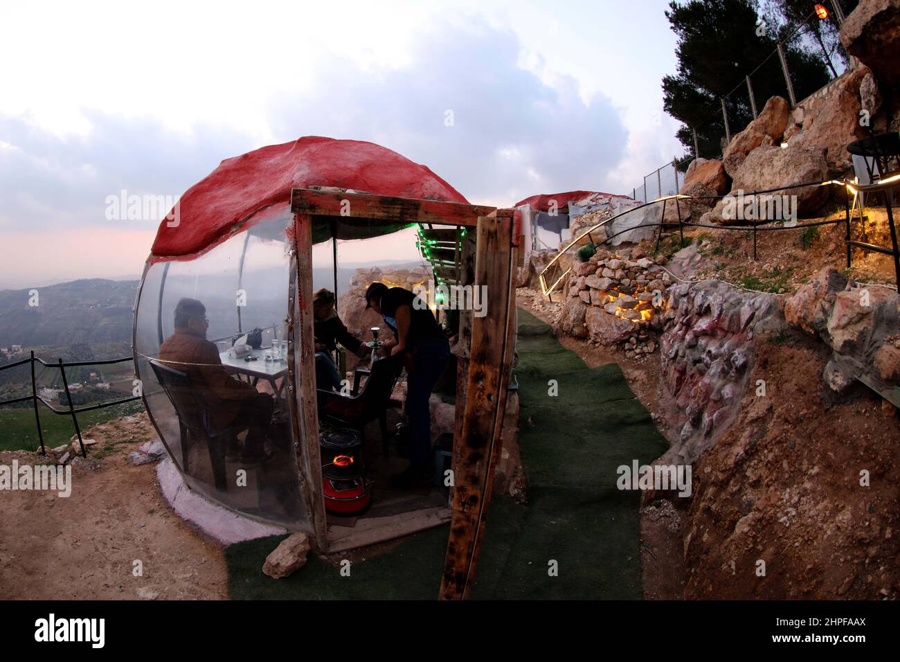 Amman, Jordan. 20th Feb, 2022. People smoke shisha in outdoor dining