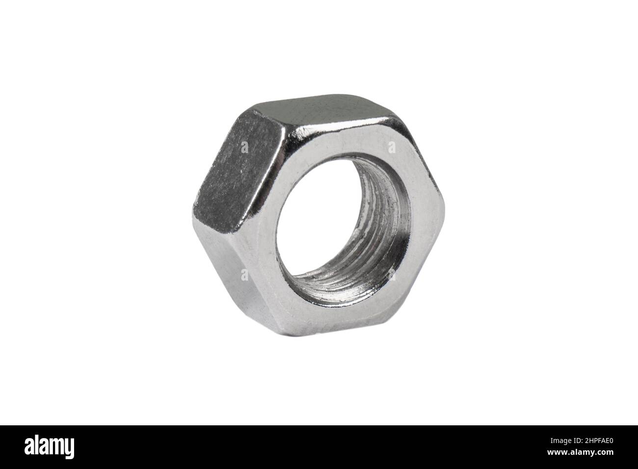 Macro shot metal nut isolated on white background. Chromed screw nut