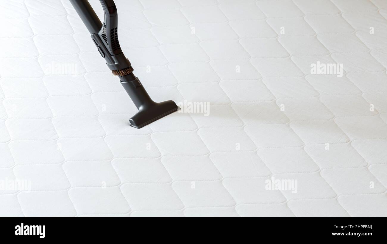 Professional cleaning mattress by vacuum cleaner from dust bacteria dirty. Vacuum cleaner machine do disinfection surfaces, cleanliness in hotel Stock Photo
