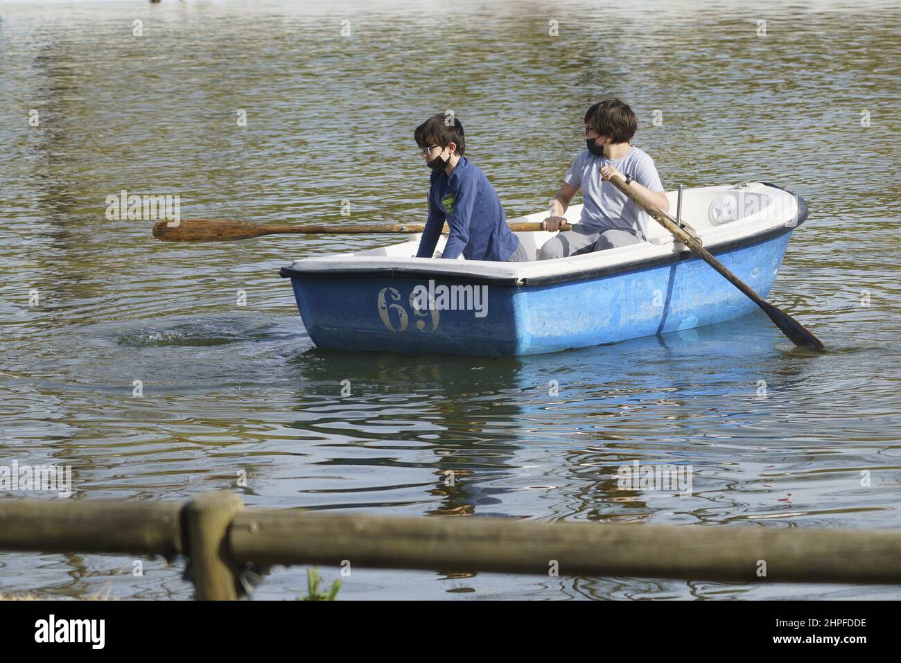 Kids riding in a rowboat in a Europe Park, Madrid, Spain Stock Photo ...