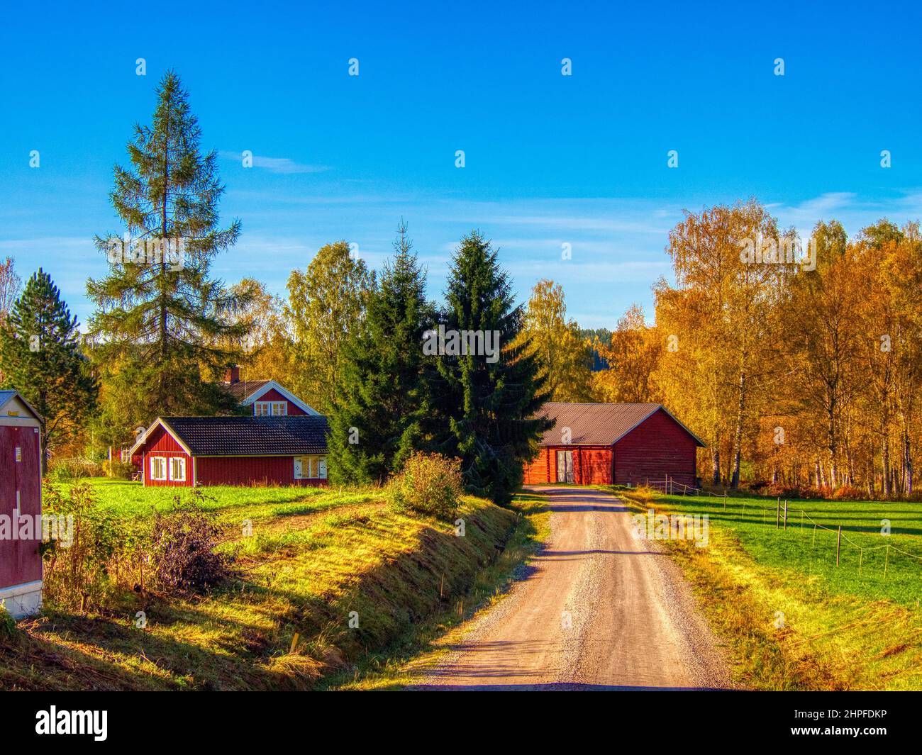 Country road with red barn and house Stock Photo Alamy
