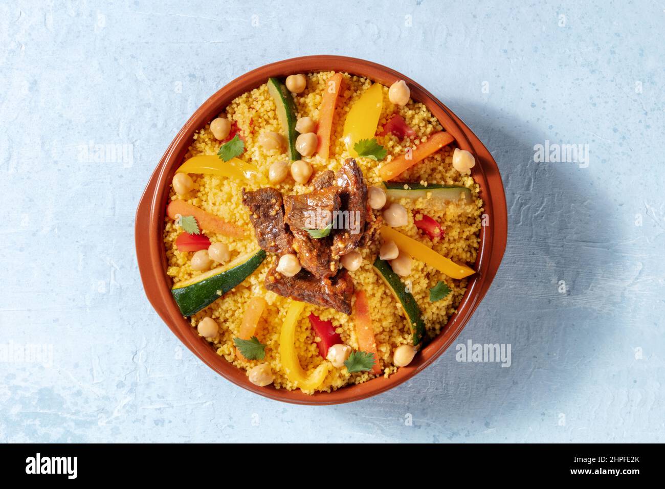 Meat and vegetable couscous, traditional Moroccan food, shot from the