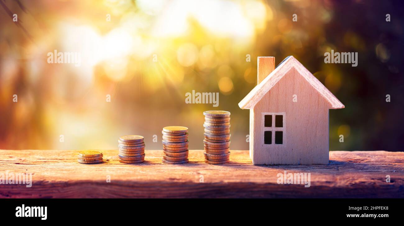 House and Money Coins - Loan Mortgage Concepts - Real Estate Stock Photo
