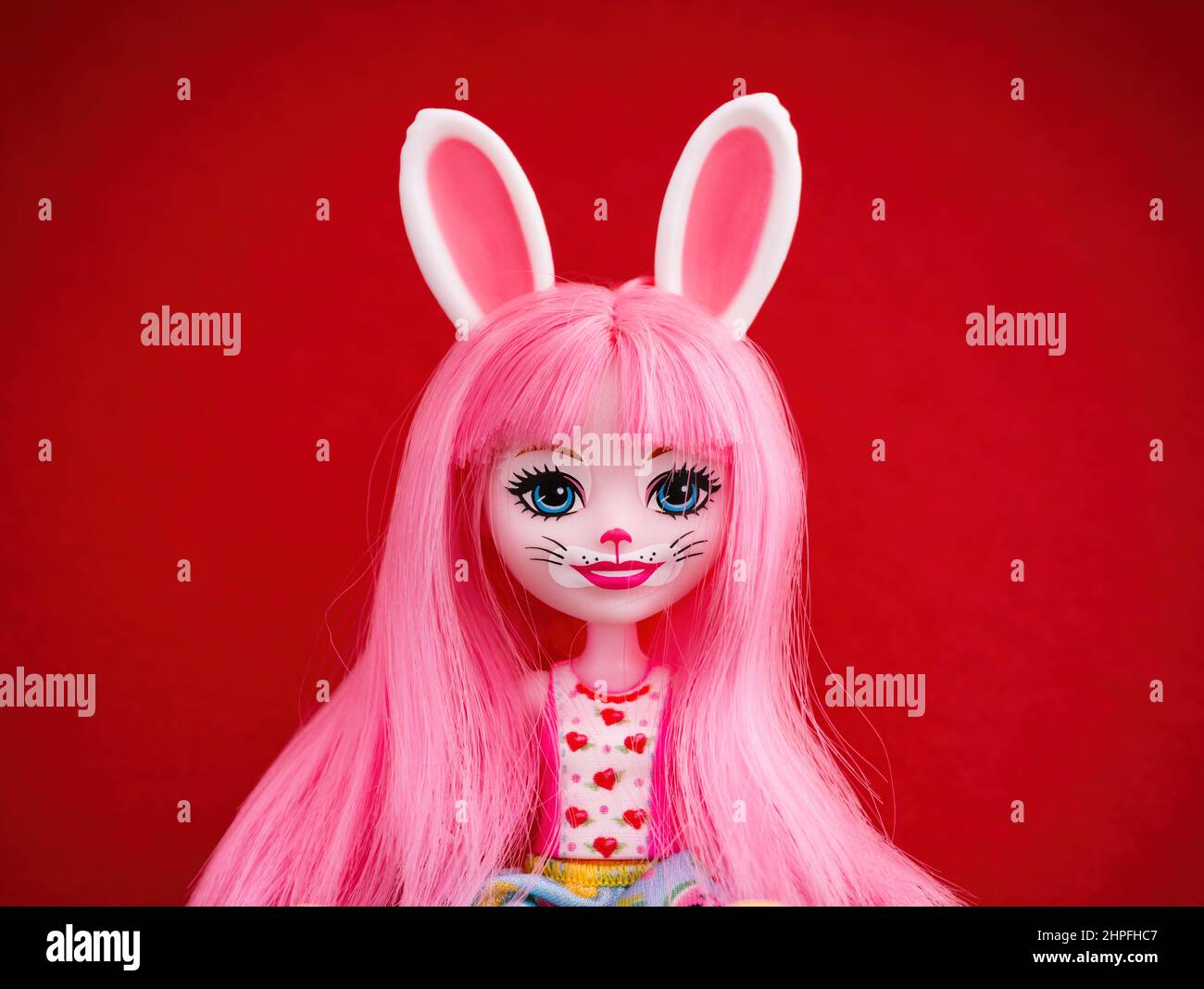 Tambov, Russian Federation - February 15, 2022 Portrait of a Mattel Enchantimals Bree Bunny Doll against red background. Stock Photo