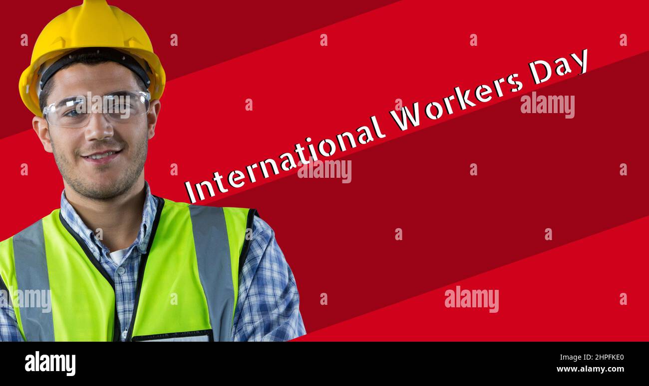 Portrait of smiling young caucasian construction worker by international workers day Stock Photo
