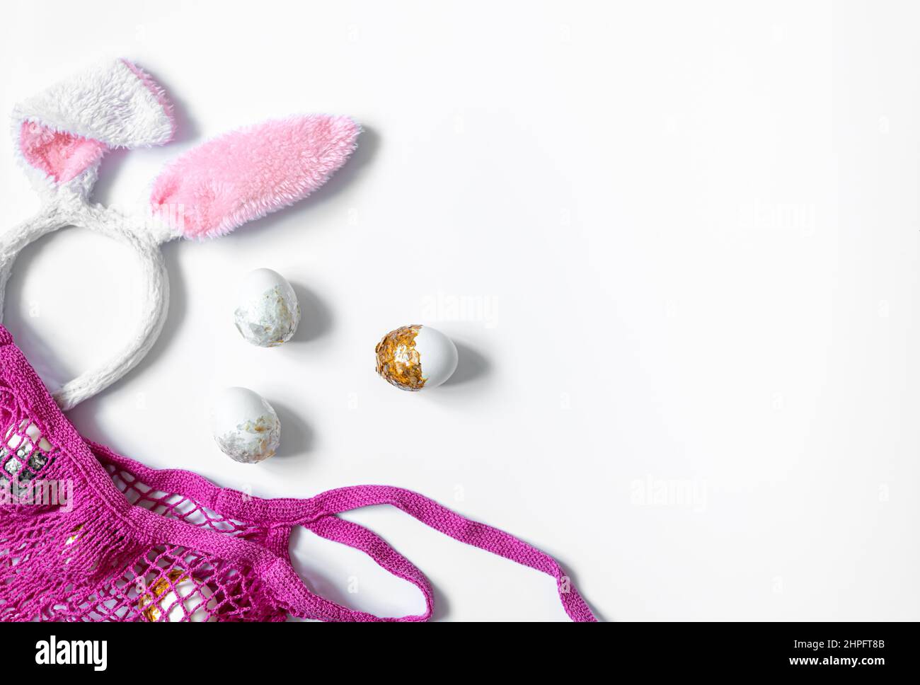Festive Easter background with eggs and string bag, copy space. Stock Photo
