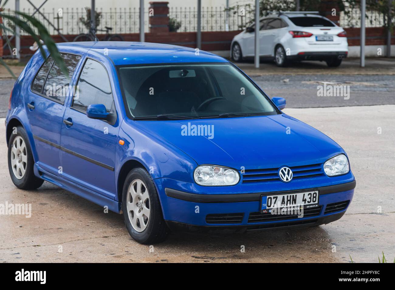 Side, Turkey -January 30, 2022: blue Volkswagen Golf is parked on the  street on a summer day against the backdrop of a buildung, trees, shops  Stock Photo - Alamy