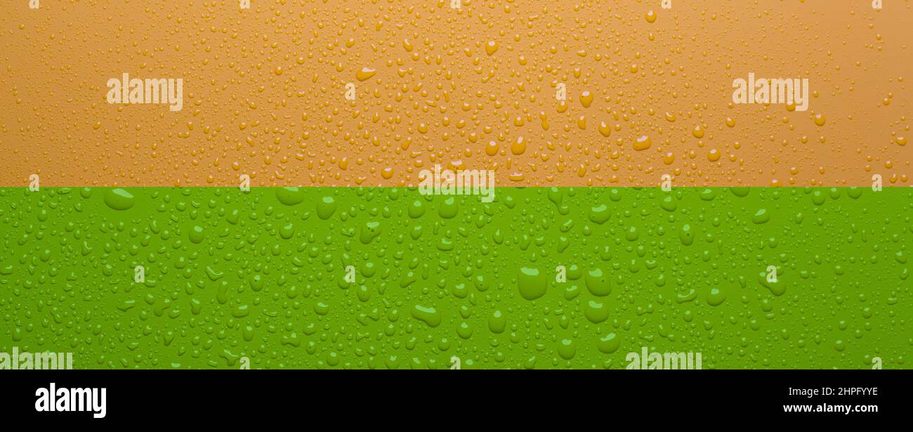 Water drops on orange color  surface Stock Photo