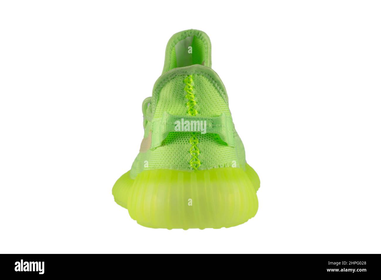 Green rag sneaker with a polyurethane sole on a white background. Stock Photo
