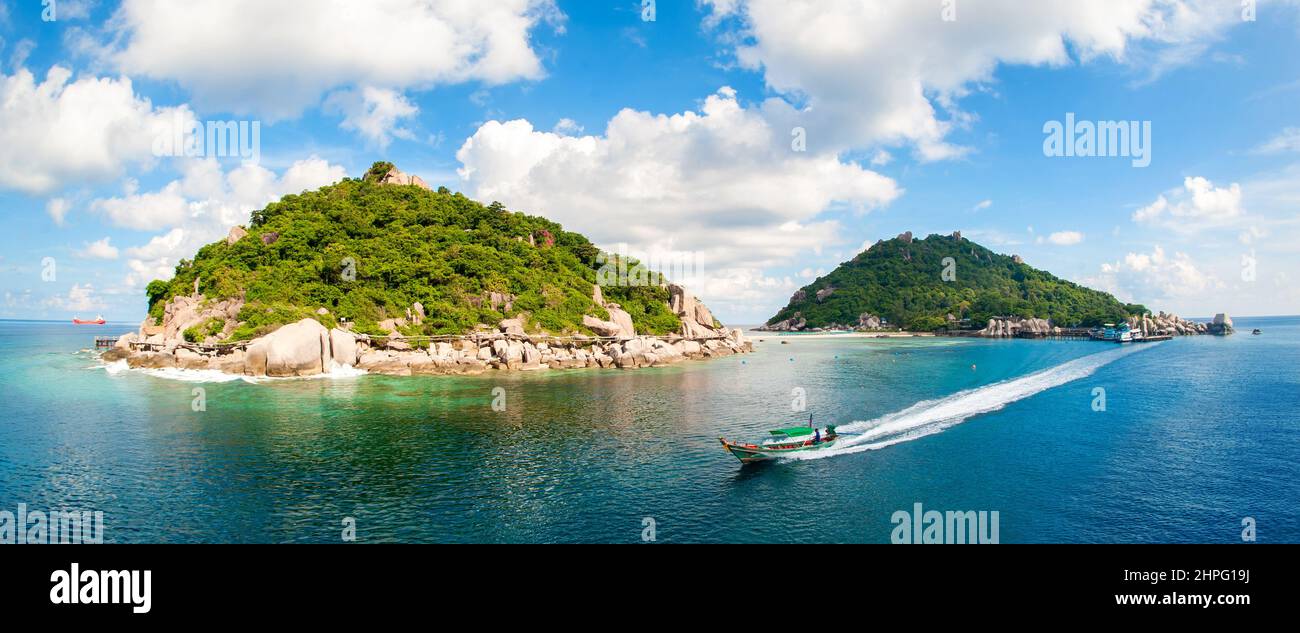 Panoramic view of amazing beautiful unique island with longtail boat. Landscape for background or wallpaper. Koh Tao, Thailand Stock Photo