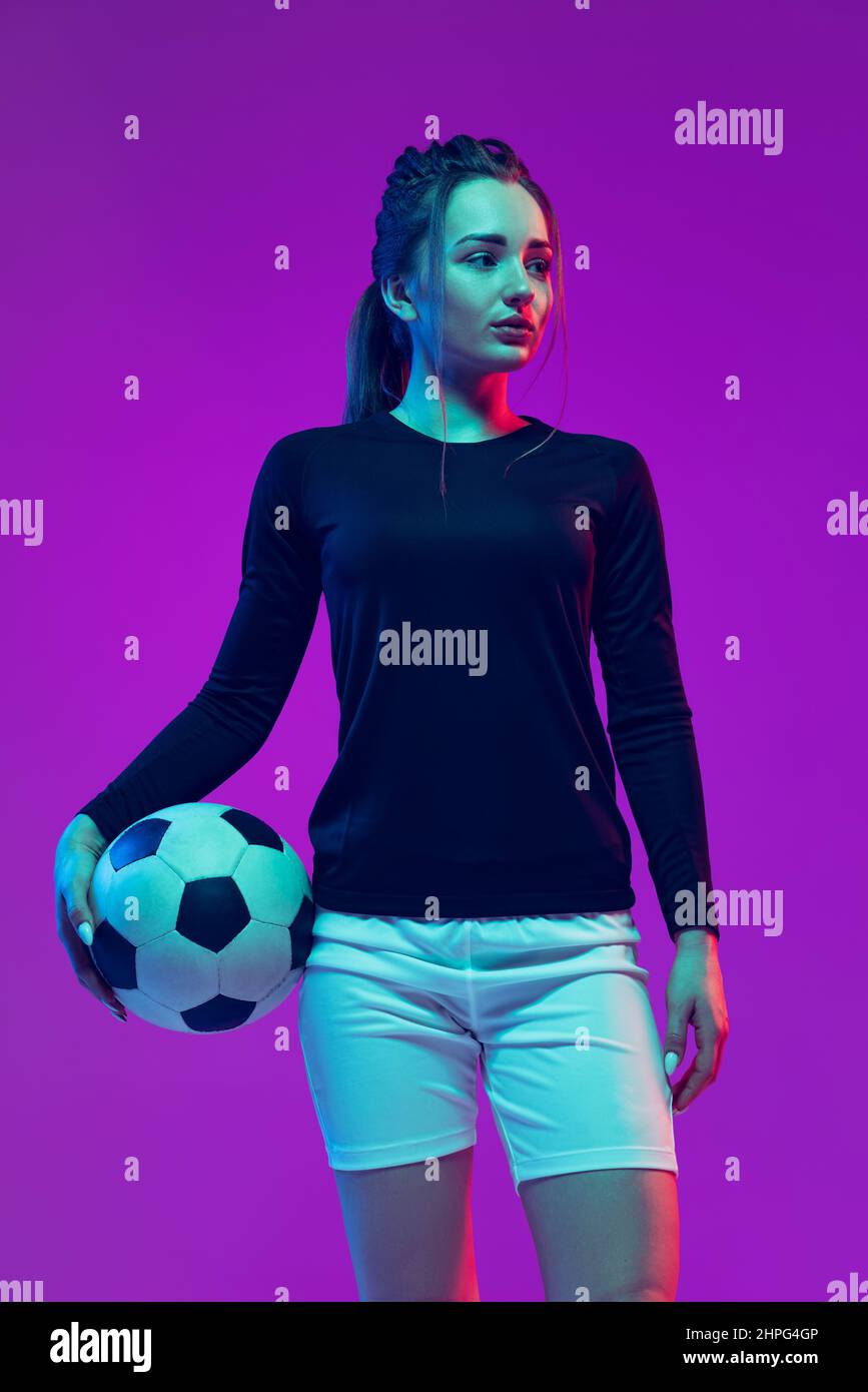 Portrait of beautiful girl, professional female soccer player posing