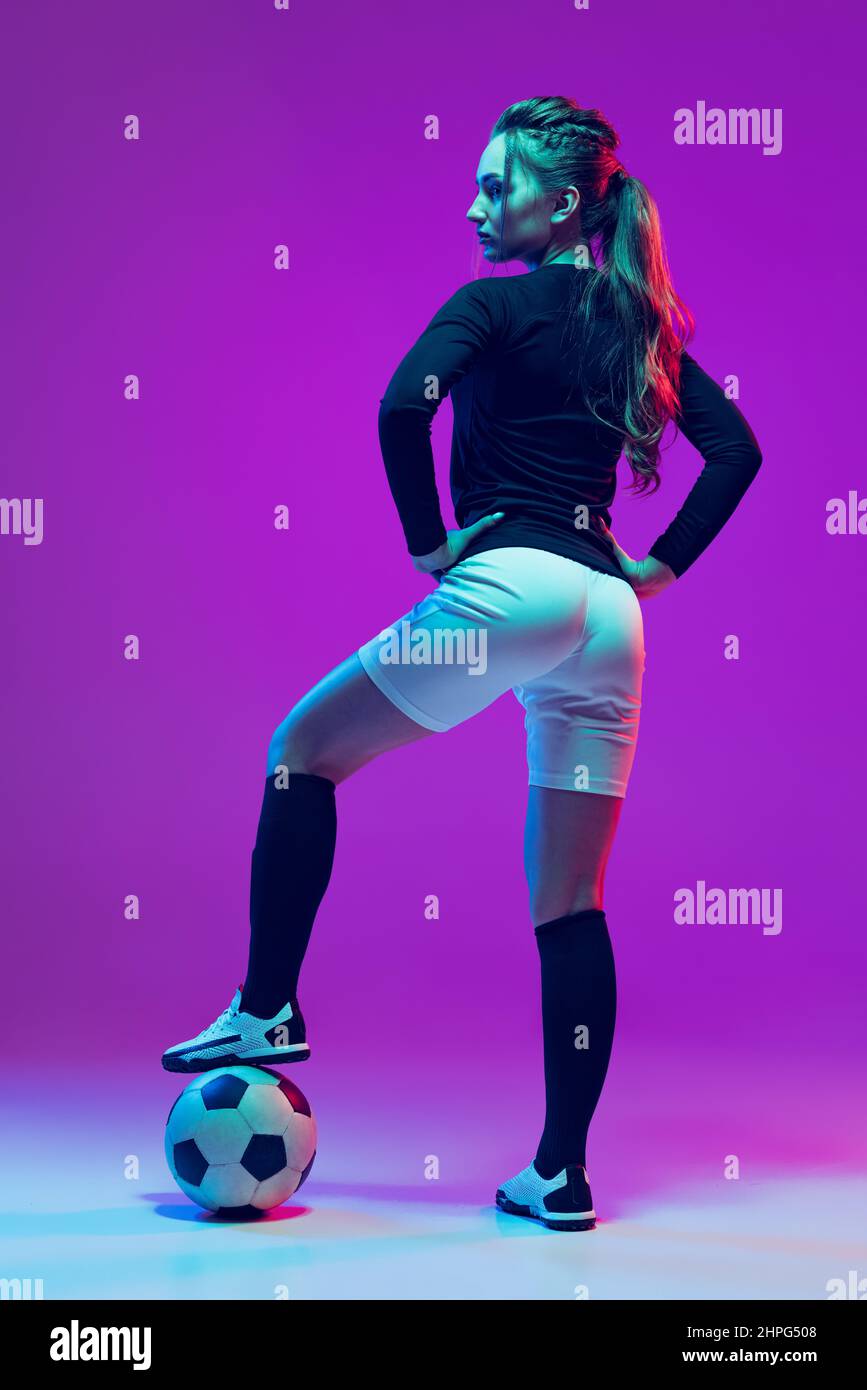 Portrait of beautiful girl, professional female soccer player posing