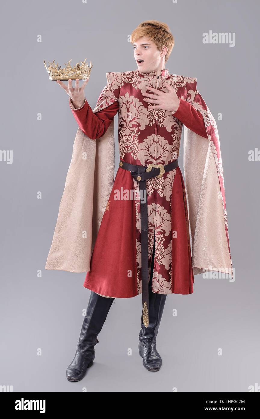 Medieval king with sword and crown Stock Photo Alamy