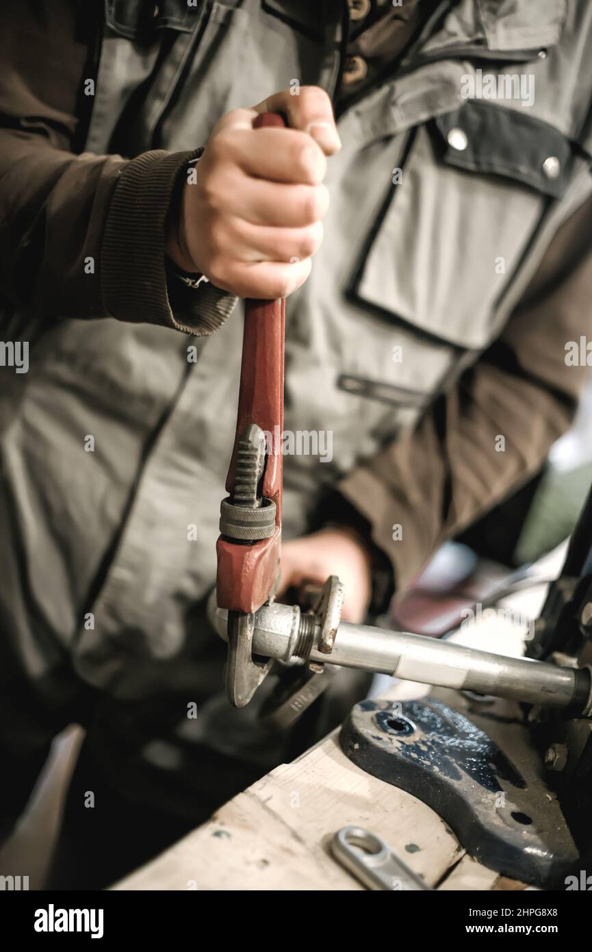 Using A Plier Young craftsman using set hi-res stock photography and images - Alamy
