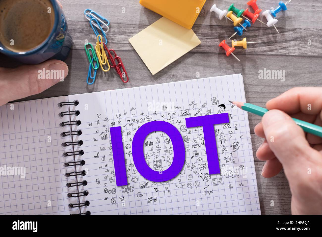 Iot concept drawn on a notepad placed on a desk Stock Photo