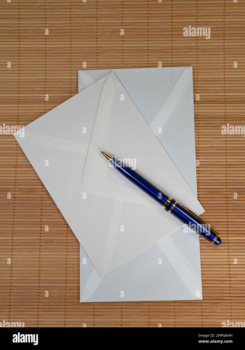 Blue ballpoint pen and two envelopes Stock Photo
