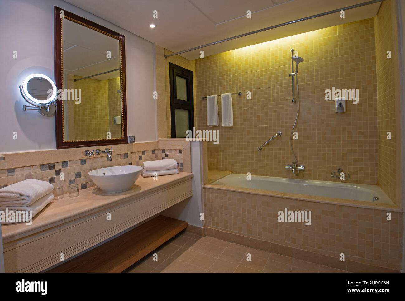 Interior design of a luxury hotel bathroom with bath and sink Stock Photo