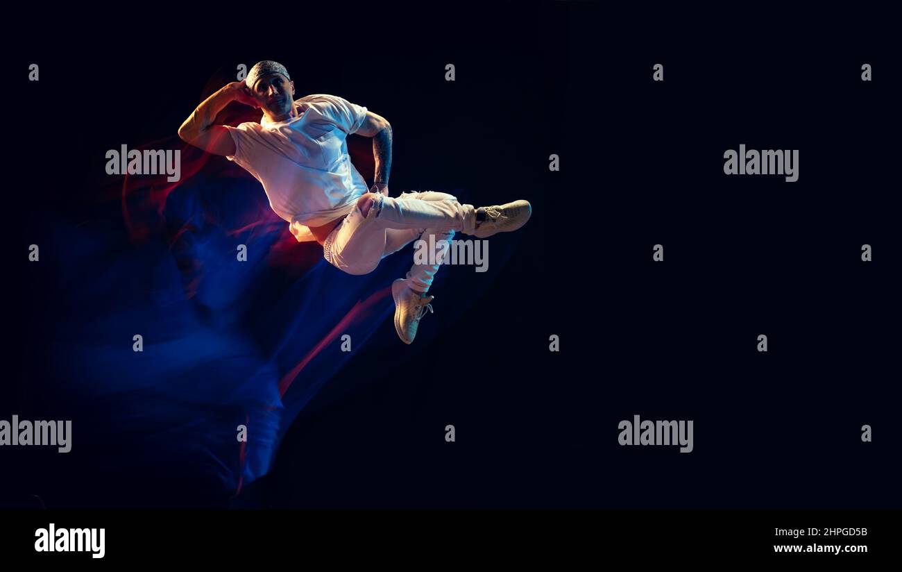 Guys Wearing Rag Levitation. Bald man wearing du-rag in white jeans and tee dancing hip ...