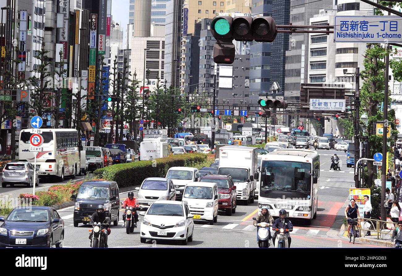 traffic in main street , Shinjuku, Tokyo Stock Photo