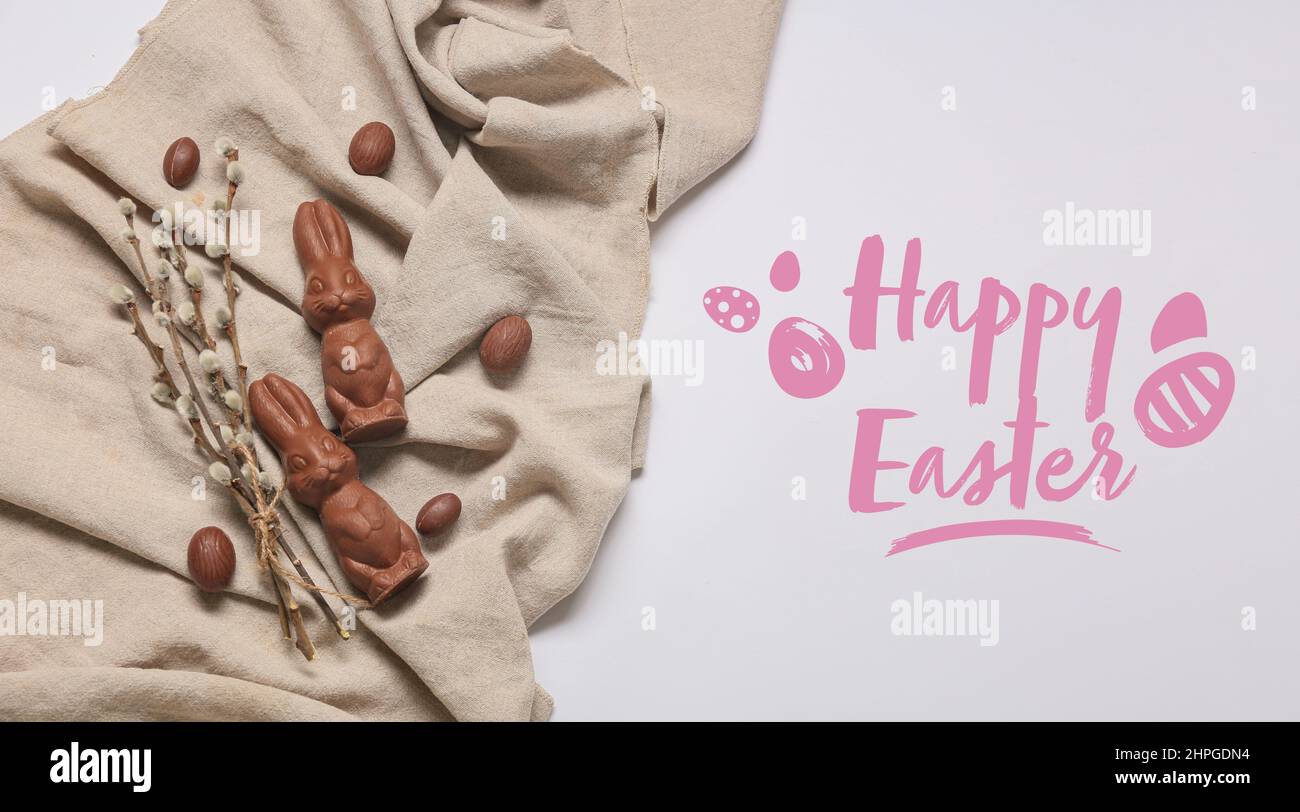 Easter greeting card with cute chocolate bunnies, eggs and pussy willow branches Stock Photo Alamy
