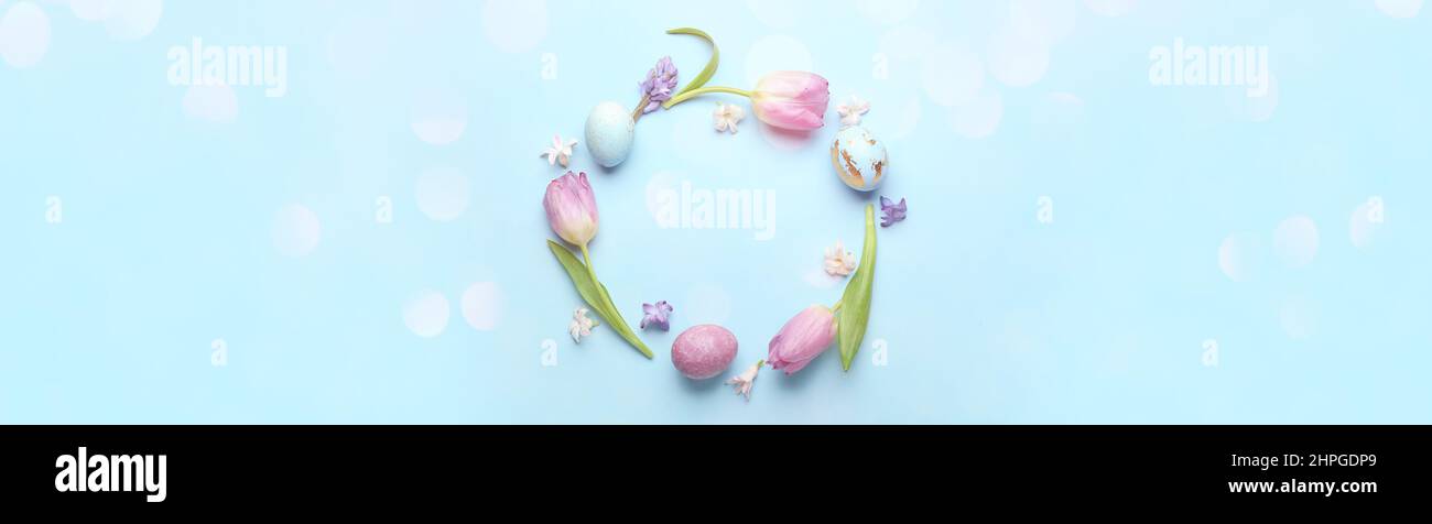 Beautiful frame made of painted Easter eggs and beautiful flowers on ...