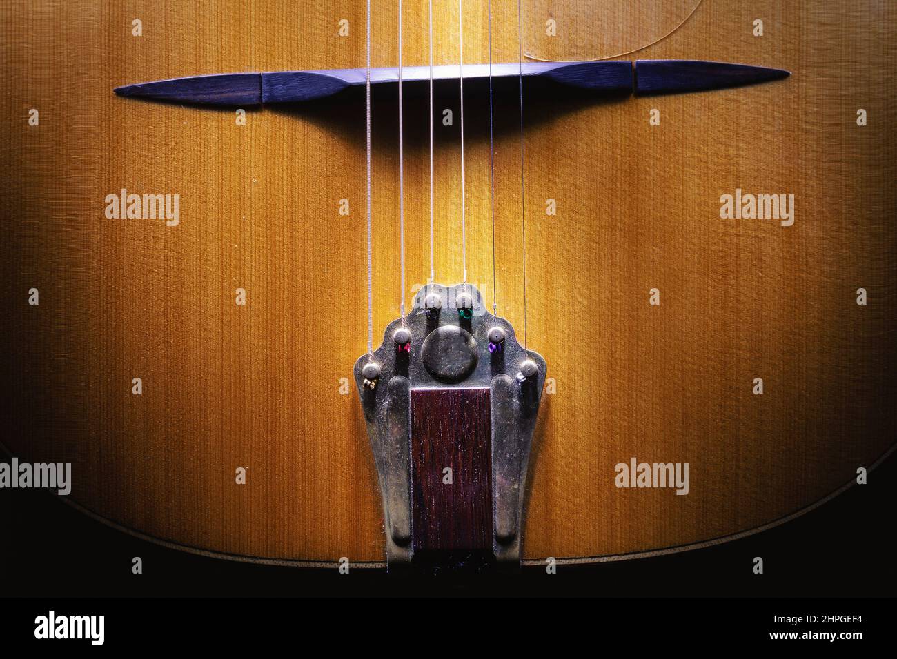 Details of tailpiece of gypsy jazz acoustic guitar, closeup view Stock