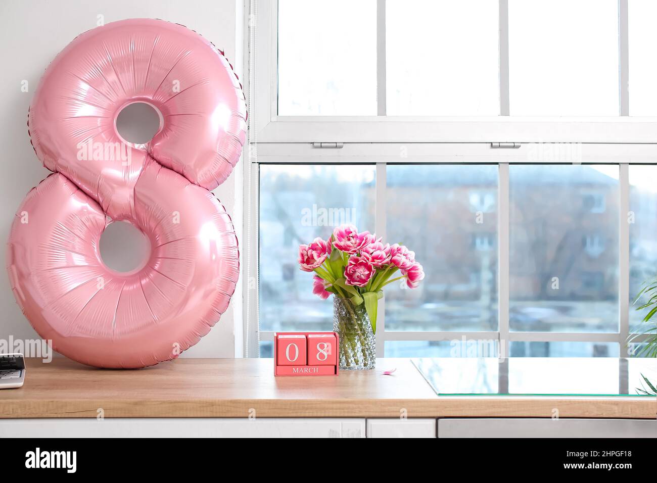 Cube Calendar Vase With Tulips And Balloon In Shape Of Figure 8 On 