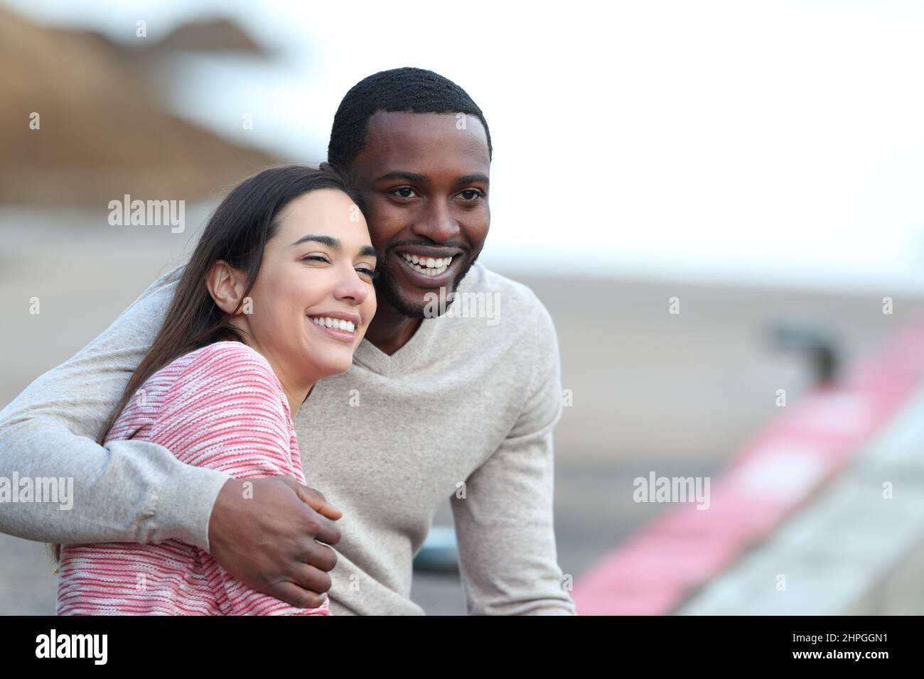 Happy couple cuddling african american hi-res stock photography and ...